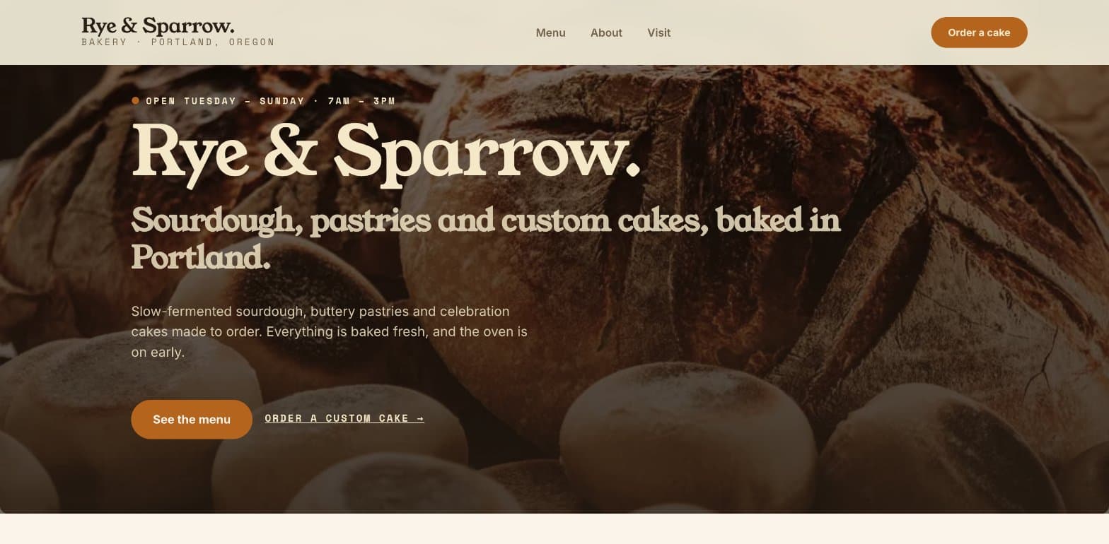 The Rye & Sparrow home page: "Open Tuesday – Sunday · 7am – 3pm", the bakery name in a large serif font over a photo of sourdough loaves, and See the menu and Order a custom cake buttons
