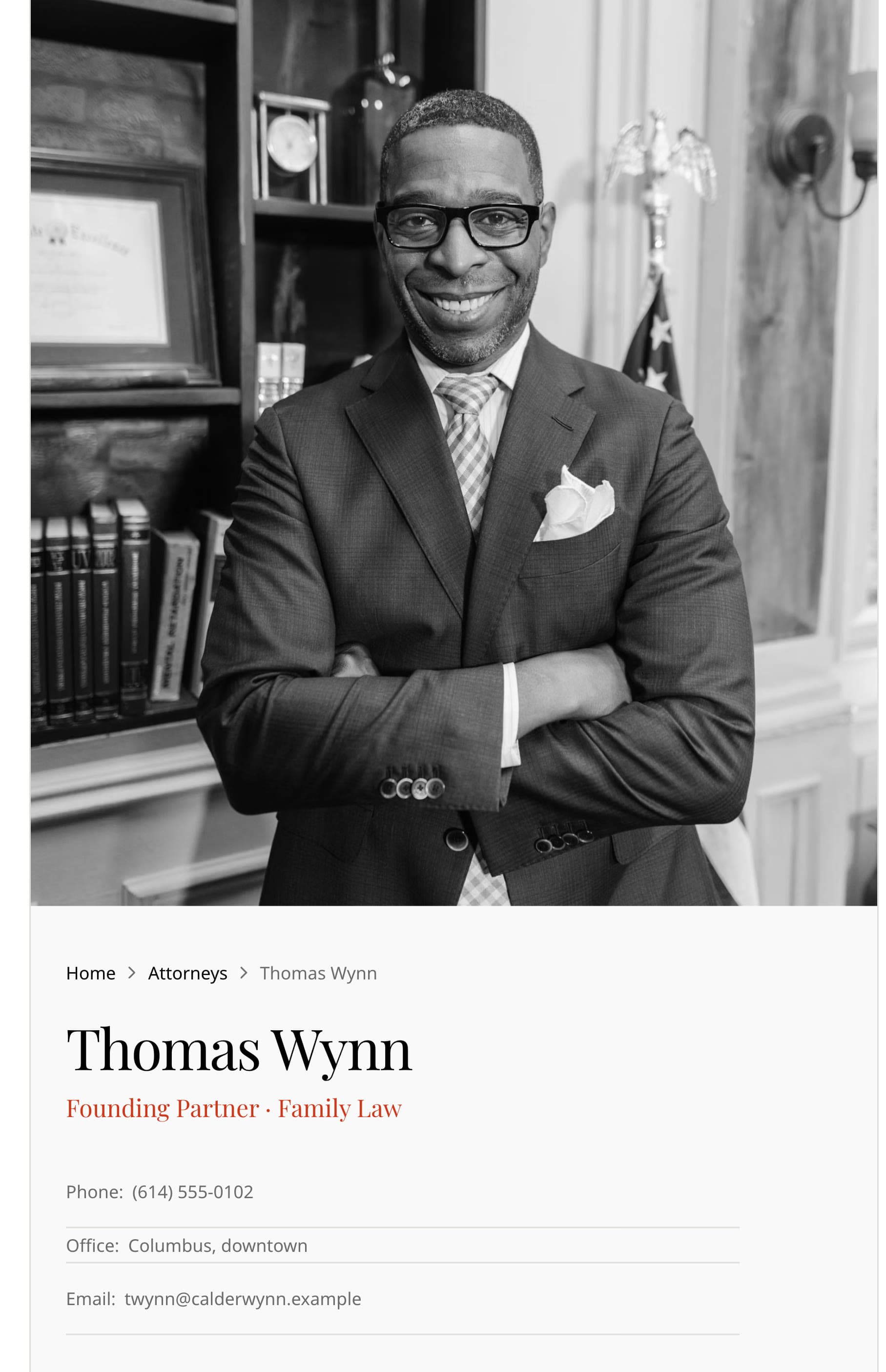 Thomas Wynn's attorney profile on a phone: a black-and-white portrait, his name, Founding Partner · Family Law, and his direct phone, office and email